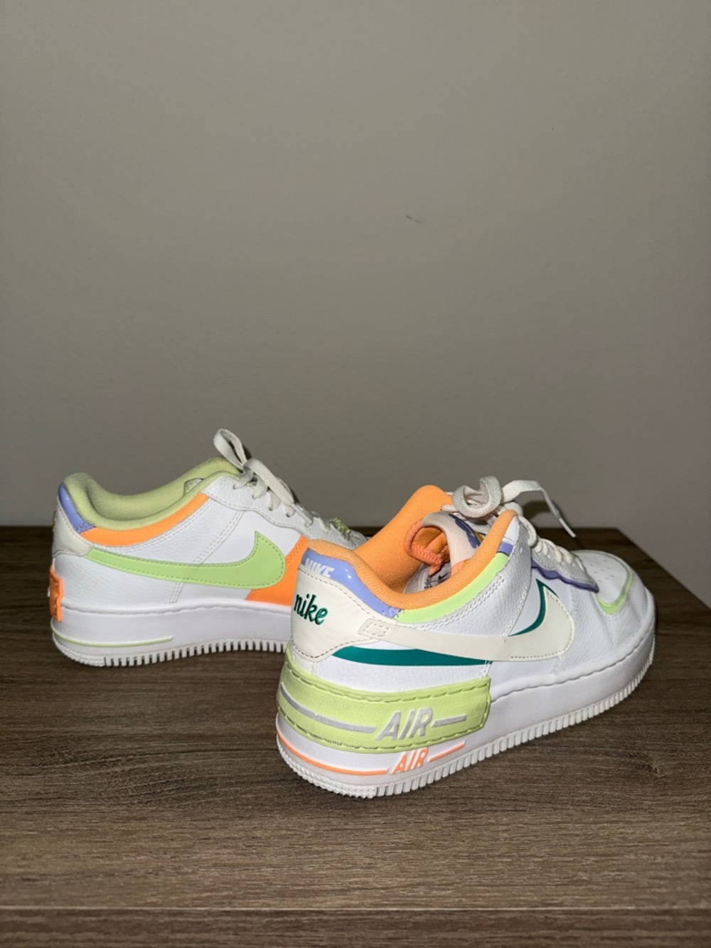 Nike White Low-Top Sneakers with Pastel Green, Orange & Teal Accents